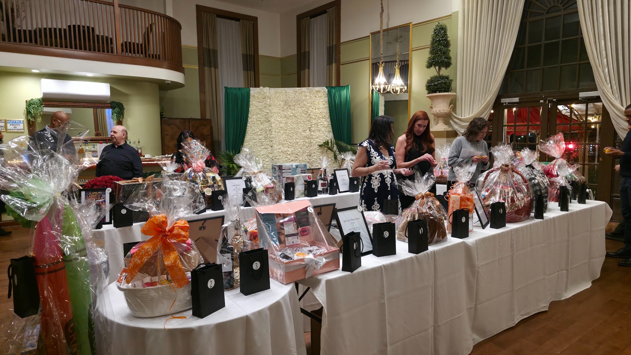 Gift baskets and auction items at the 2026 Evening of Tastings event