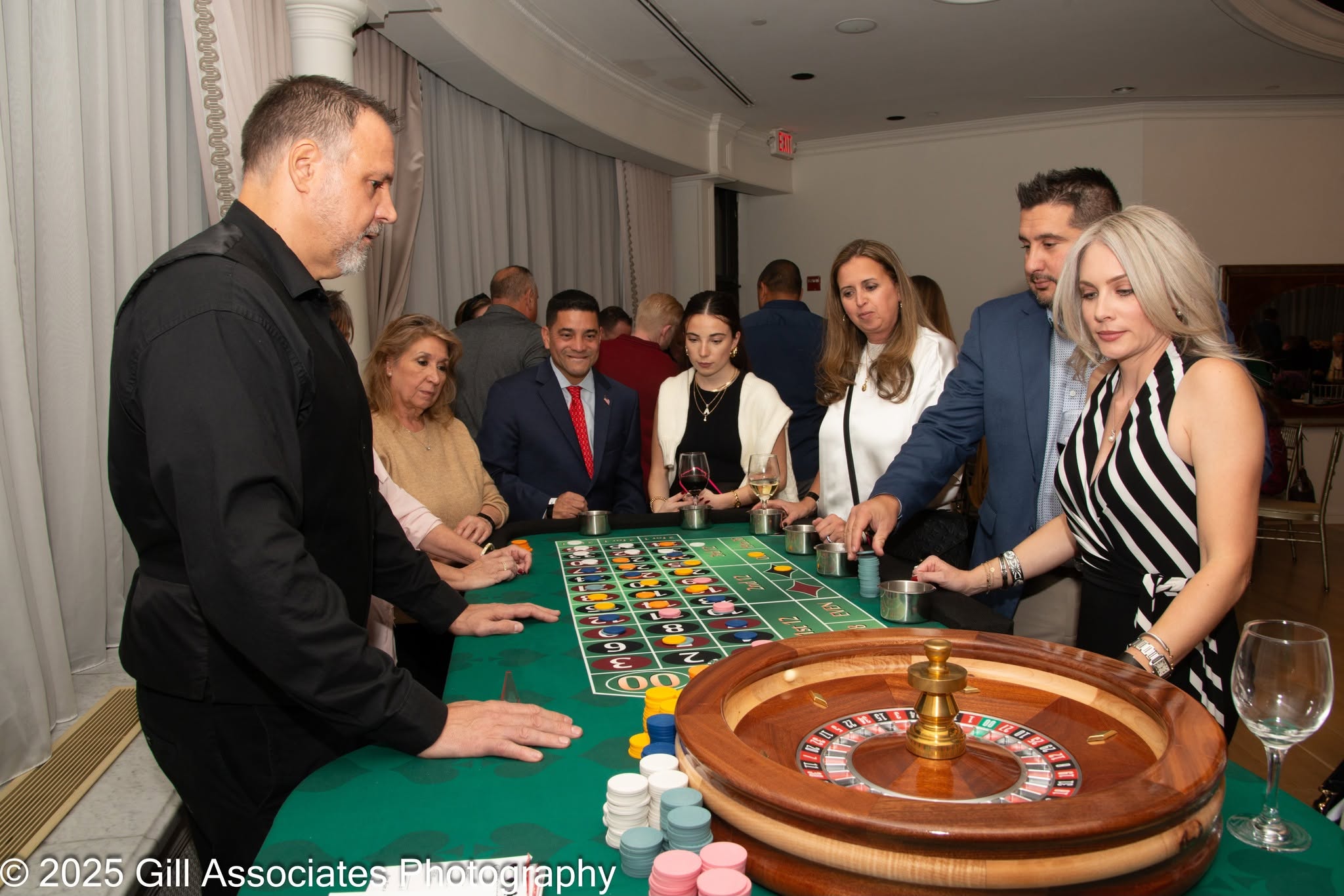 Guests enjoying the roulette table at Evening of Tastings