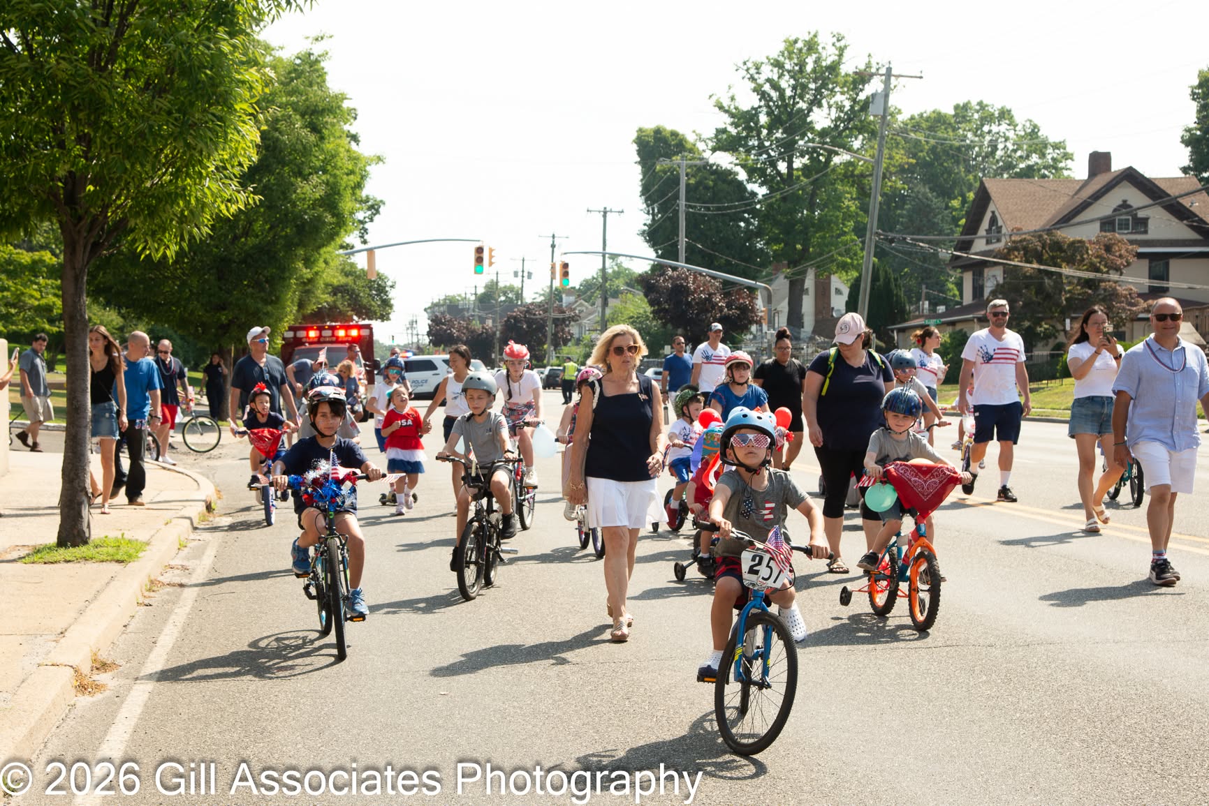 Children and families participating in the Glen Cove July 4th Bike Parade